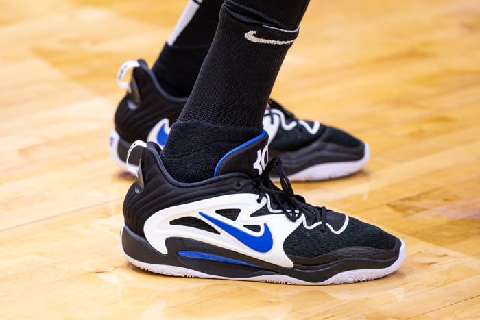 View of black, white, and blue Nike KD shoes.